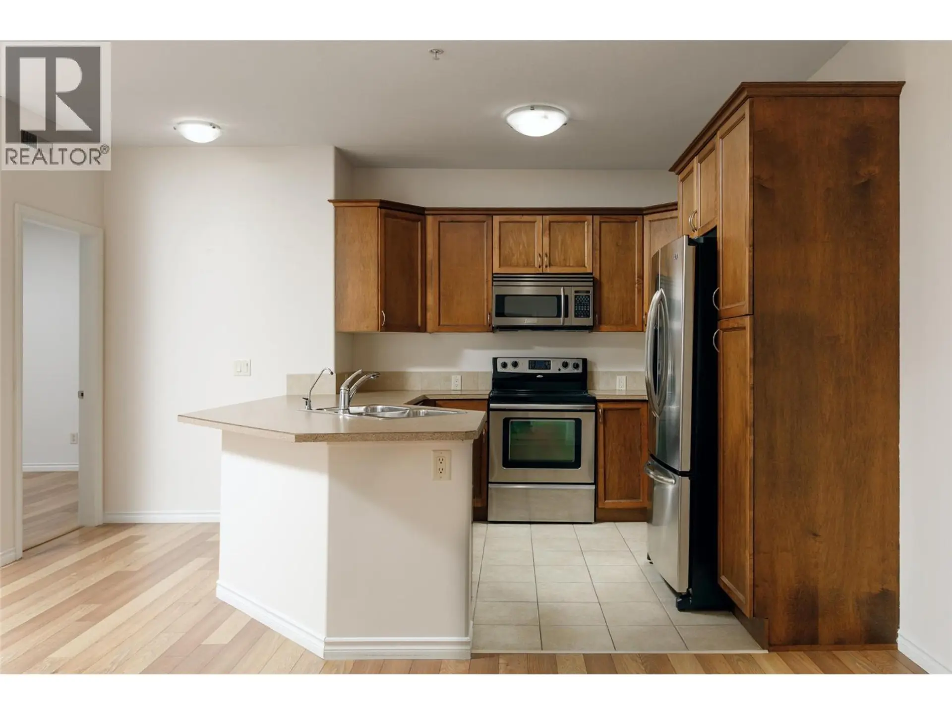 Property at #208 1007 Harvey Avenue, Kelowna, BC