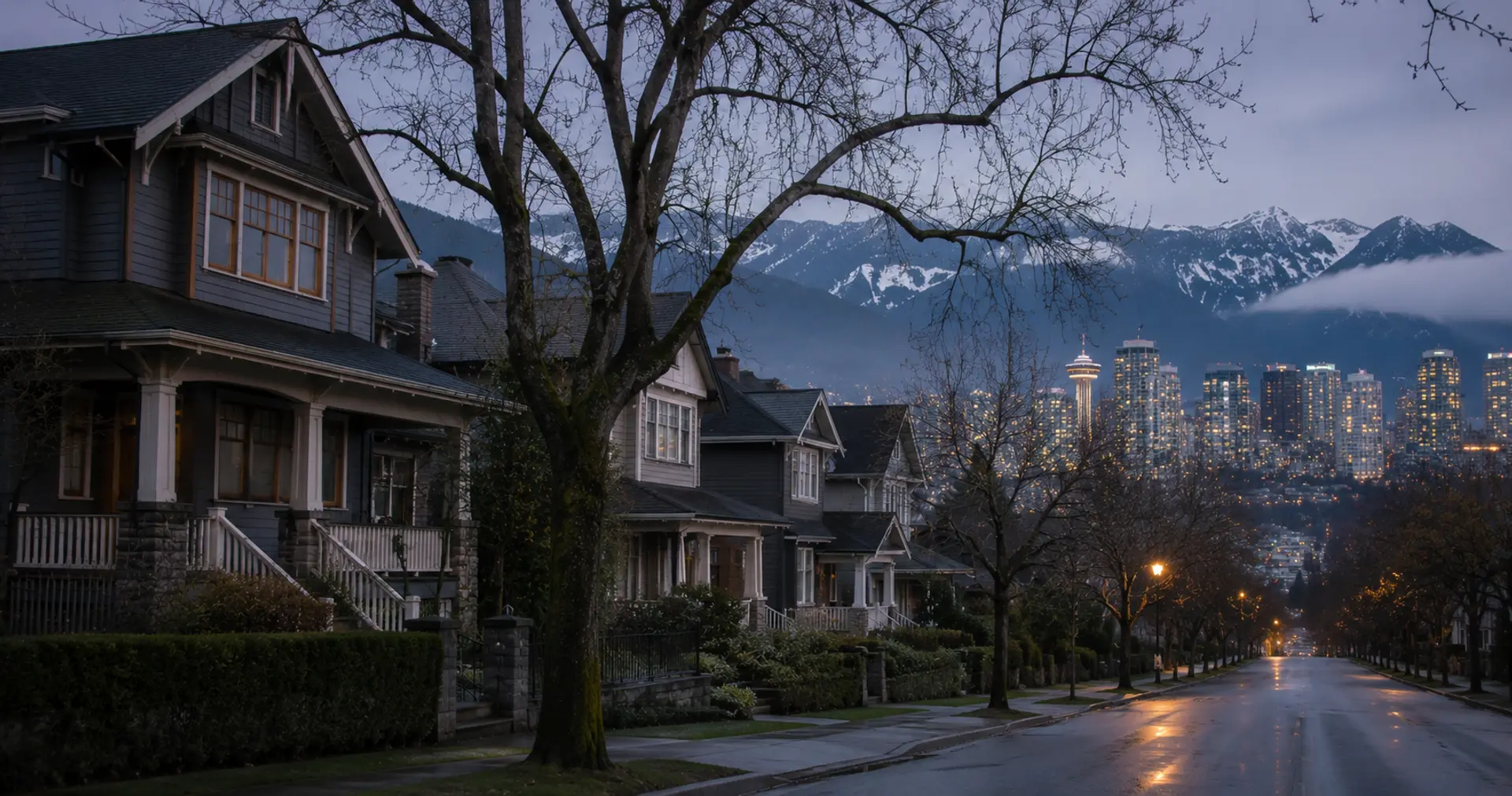 Empty Vancouver homes at dusk with downtown skyline and North Shore mountains in background