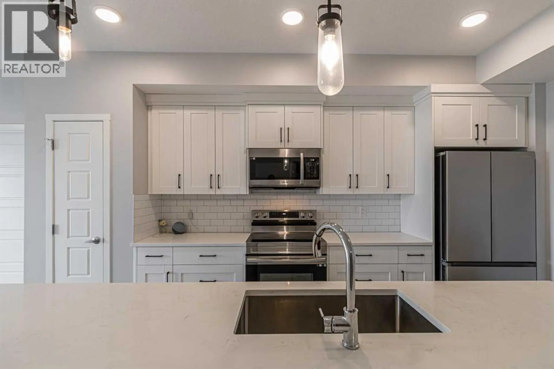 #203 360 HARVEST HILLS WAY NE - Image 2