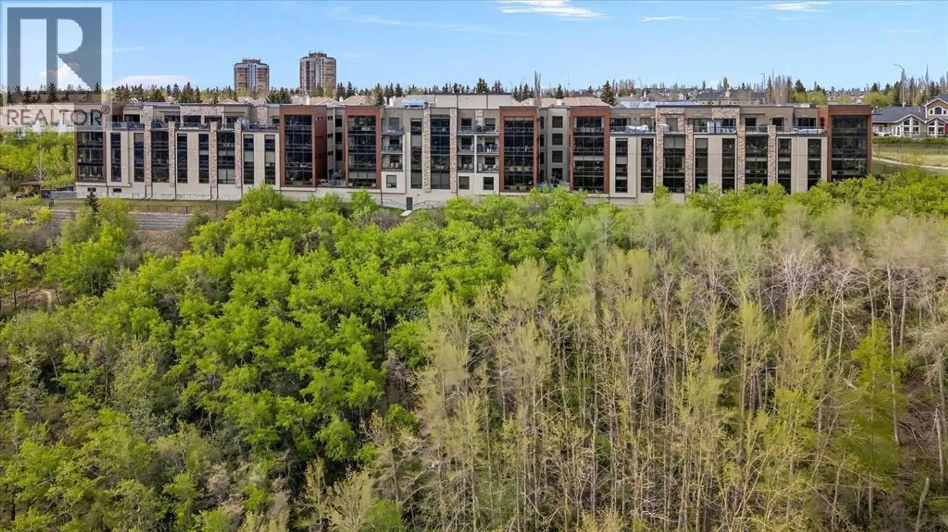 Property at #209 15 Cougar Ridge Landing SW, Calgary, AB